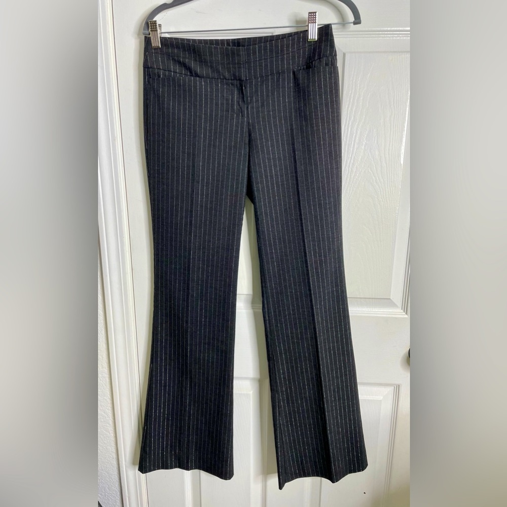 Dark gray low rise straight leg trousers.